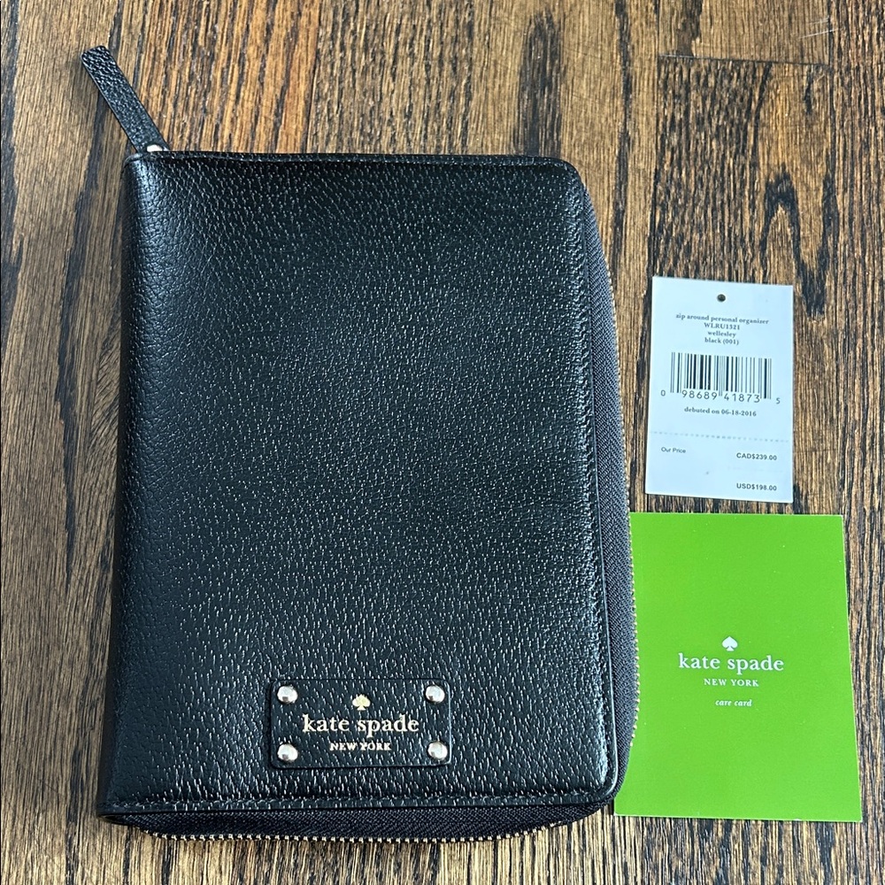Black leather Kate Spade Wellesley zip around personal organizer/planner